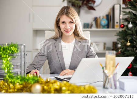 Businesswoman working at Christmas Businesswoman working at Christmas 102007115