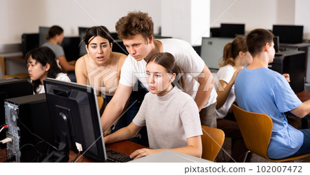 Teenager boy and girl studying in computer class Teenager boy and girl studying in computer class 102007472