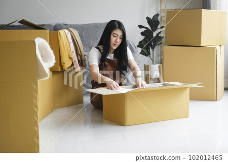 Modern female people in moving home apartment leisure indoor activity alone. Modern female people in moving home apartment leisure indoor activity alone. 102012465