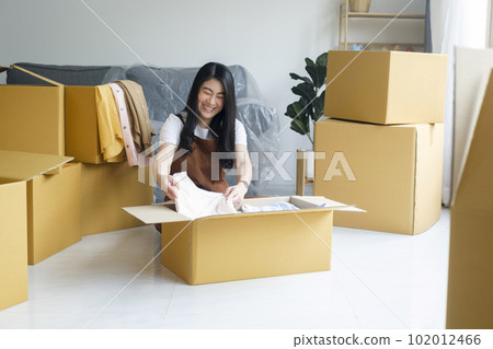 Modern female people in moving home apartment leisure indoor activity alone. Modern female people in moving home apartment leisure indoor activity alone. 102012466