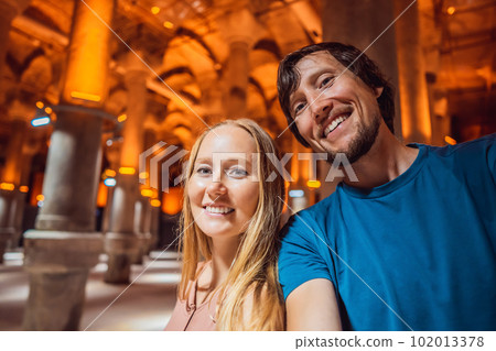 Happy couple enjoying Beautiful cistern in Istanbul. Cistern - underground water reservoir build in 6th century, Istanbul, Turkey, Turkiye Happy couple enjoying Beautiful cistern in Istanbul. Cistern - underground water reservoir build in 6th century, Istanbul, Turkey, Turkiye 102013378