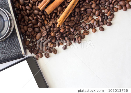 Smart phone,camera and coffee beans on white background Smart phone,camera and coffee beans on white background 102013736