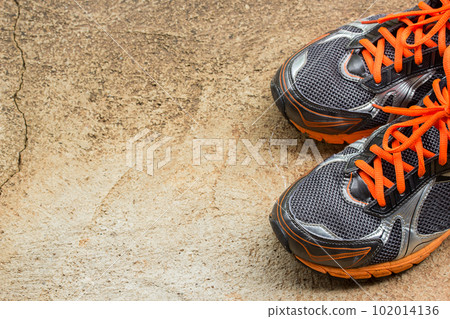 men's running shoes on a street men's running shoes on a street 102014136