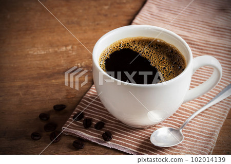 Cups of coffee on napkin on table Cups of coffee on napkin on table 102014139