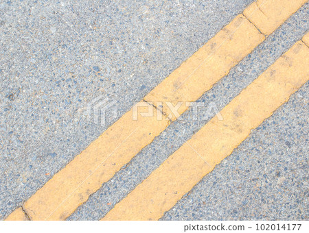 Road Marking -  yellow line on the road texture 102014177