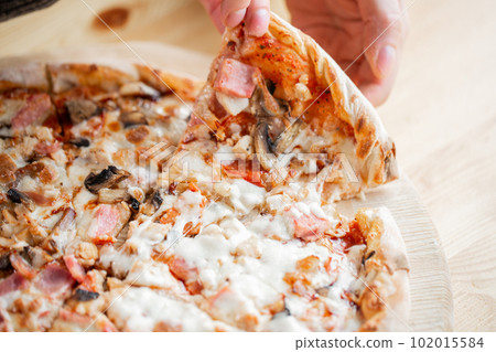 one people taking slices of pizza out of the box. fast delivery of food. packaging for fast food. top view 102015584