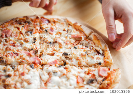 one people taking slices of pizza out of the box. fast delivery of food. packaging for fast food. top view 102015596