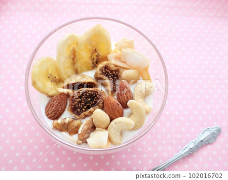 Dried fruit and nuts in yogurt Dried fruit and nuts in yogurt 102016702