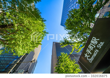Tokyo cityscape in Japan Otemachi Station in front of the Otemachi intersection and skyscrapers shining in the fresh greenery = April 102016875