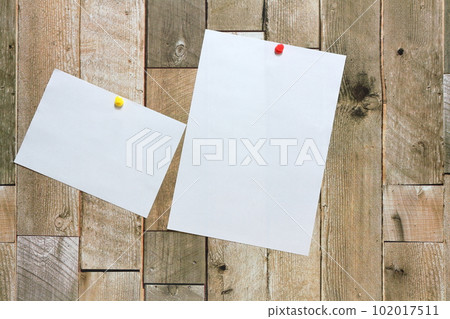 White paper pinned to the wall White paper pinned to the wall 102017511
