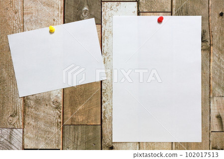 White paper pinned to the wall 102017513