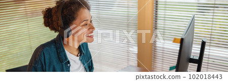 Woman designer works in home office drawing on graphic tablet. Freelancer working on project 102018443
