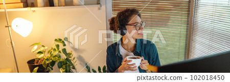 Afro american woman interior designer drinking tea during break at home office. Freelance concept Afro american woman interior designer drinking tea during break at home office. Freelance concept 102018450