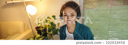 Afro american woman interior designer drinking tea during break at home office. Freelance concept 102018458