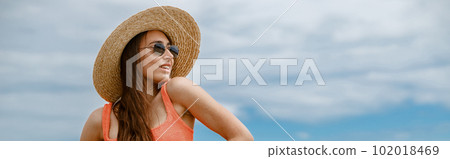 Sexy woman at beach in swimsuit with ideal fitness body on background of ocean looking away Sexy woman at beach in swimsuit with ideal fitness body on background of ocean looking away 102018469