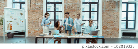 Business innovation group using laptops for marketing report and statistics 102019323