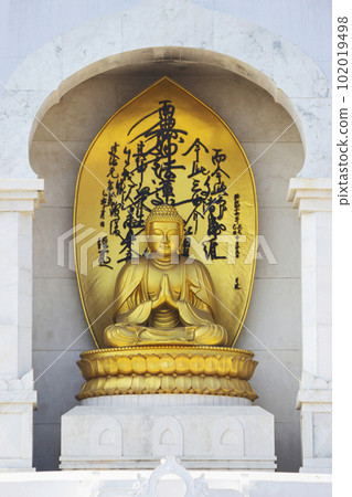 Golden statue of Lord Budhha on the Vishwa Shanti Stupa of Rajgir, Build in 1969 By NeoBudhism, Rajgir, Nalanda, Bihar.. Golden statue of Lord Budhha on the Vishwa Shanti Stupa of Rajgir, Build in 1969 By NeoBudhism, Rajgir, Nalanda, Bihar.. 102019498