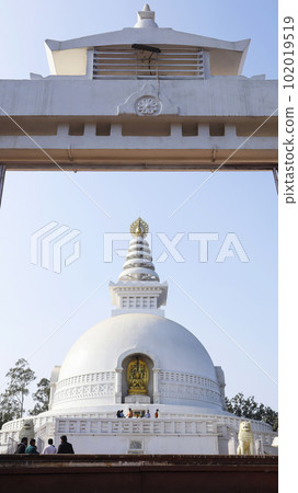 INDIA, BIHAR, NALANDA, February 2023, Devotee at Vishwa Shanti Stupa, Rajgir, rear view INDIA, BIHAR, NALANDA, February 2023, Devotee at Vishwa Shanti Stupa, Rajgir, rear view 102019519