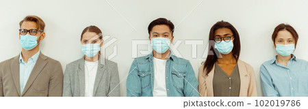 Business people standing on the white wall background 102019786