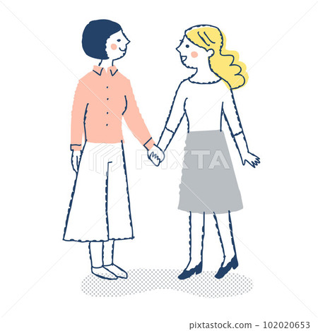 Two young women looking at each other and holding hands Two young women looking at each other and holding hands 102020653