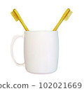 a wooden-handled toothbrush 102021669