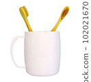 a wooden-handled toothbrush 102021670