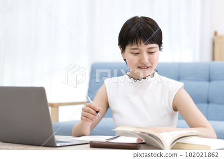 Young woman studying 102021862
