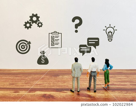 Three people in a meeting about business model 102022984