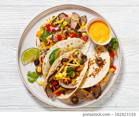 Beef Steak Tacos with veggies, avocado, corn Beef Steak Tacos with veggies, avocado, corn 102023150