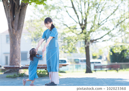 Parent and child connecting hands 102023368