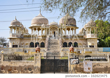 Colourful paintings on the outer wall of an old chhatri, converted in to a heritage hotel called Royal Rest, located in Mandawa, Shekhawati, Rajasthan, India Colourful paintings on the outer wall of an old chhatri, converted in to a heritage hotel called Royal Rest, located in Mandawa, Shekhawati, Rajasthan, India 102023475