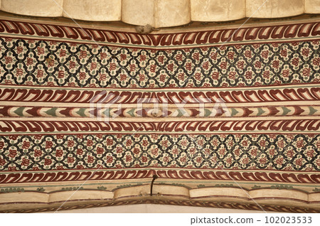 Colourful paintings on the ceiling of Shri Raghunath Ji Ka Bada Mandir, located in Mahansar, Shekhawati, Rajasthan, India 102023533