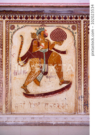 Colourful paintings on the outer wall of Shri Raghunath Ji Ka Bada Mandir, located in Mahansar, Shekhawati, Rajasthan, India 102023534