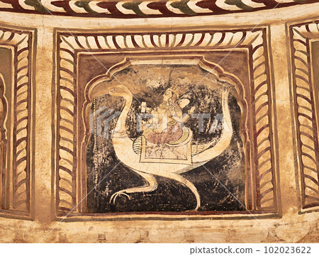 Colourful mythological paintings on the ceiling of an old chhatri (cenotaph), Seth Anantram Podar and family ki smarak rupi chhatri, located in Ramgarh, Shekhawati, Rajasthan, India 102023622