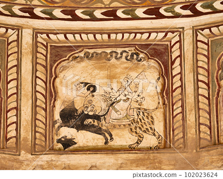 Colourful mythological paintings on the ceiling of an old chhatri (cenotaph), Seth Anantram Podar and family ki smarak rupi chhatri, located in Ramgarh, Shekhawati, Rajasthan, India 102023624