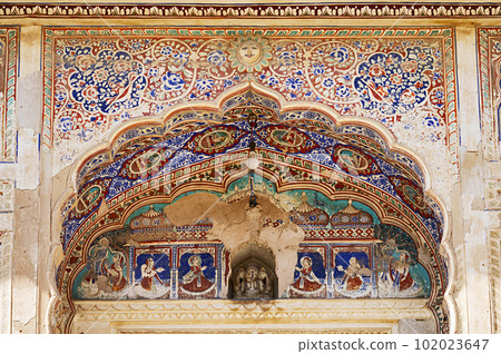 Colourful mythological paintings on the ceiling of an entrance gate of Khemka Balaji Mandir, located in Ramgarh, Shekhawati, Rajasthan, India Colourful mythological paintings on the ceiling of an entrance gate of Khemka Balaji Mandir, located in Ramgarh, Shekhawati, Rajasthan, India 102023647