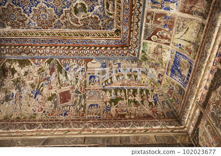 Colourful mythological paintings and mirror work on the ceiling of a small Shani Mandir, located in Ramgarh, Shekhawati, Rajasthan, India Colourful mythological paintings and mirror work on the ceiling of a small Shani Mandir, located in Ramgarh, Shekhawati, Rajasthan, India 102023677
