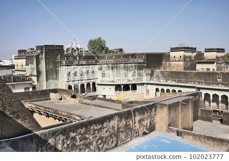 Old buildings near Mandawa haveli, Colourful paintings on the inner wall of Mandawa haveli, now converted in to a Heritage Hotel, built in 1890, located in Mandawa, Shekhawati, Rajasthan, India 102023777