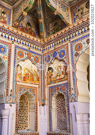 Colourful paintings on the ceiling of an entrance gate of Raghu Nath Ji Mandir, dedicated to Lord Rama and Sita, located in Mandawa, Shekhawati, Rajasthan, India Colourful paintings on the ceiling of an entrance gate of Raghu Nath Ji Mandir, dedicated to Lord Rama and Sita, located in Mandawa, Shekhawati, Rajasthan, India 102023827