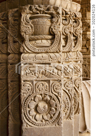 Carved stone pillars displayed in the corridor of Chand Baori, a deep four-sided stepwell. It extends 30m (100ft) into the ground, making it one of the deepest and largest stepwells in India. 102024116