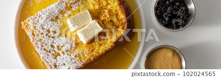 Butter melting on fresh piece of bread Butter melting on fresh piece of bread 102024565