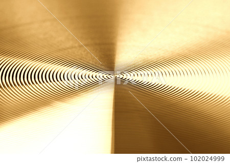 Texture of golden metal. Round metal texture. Metal texture background. Extrem close-up. Texture of golden metal. Round metal texture. Metal texture background. Extrem close-up. 102024999