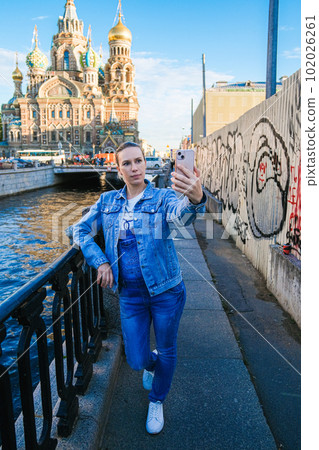 woman using phone in a city Modern lifestyle connection, casual business concept 102026261