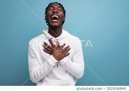 joyful winner african 20s man with dreadlocks on background with copy space joyful winner african 20s man with dreadlocks on background with copy space 102026940
