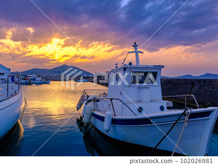 Colorful sunset in fishermen village and harbour. Colorful sunset in fishermen village and harbour. 102026981