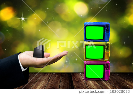 TV shopping concept, Businessman handheld shopping bag with TV with green screen and bokeh background 102028053