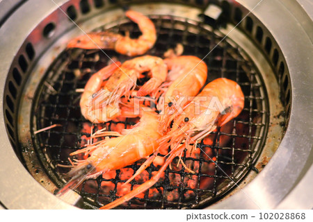 Grill shrimp at stove, BBQ close up shot Grill shrimp at stove, BBQ close up shot 102028868