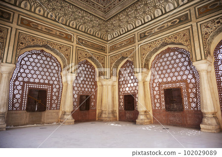 Interiors of the Hawa Mahal or Wind Palace, built from red and pink sandstone. It is akin to a honeycomb with its 953 small windows called Jharokhas decorated with intricate latticework, Jaipur, Interiors of the Hawa Mahal or Wind Palace, built from red and pink sandstone. It is akin to a honeycomb with its 953 small windows called Jharokhas decorated with intricate latticework, Jaipur, 102029089