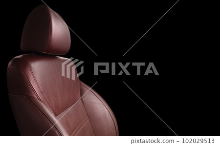 Modern luxury car red leather with alcantara interior. Part of red leather car seat details with white stitching. Interior of prestige car. Perforated leather seats isolated. Perforated leather. Modern luxury car red leather with alcantara interior. Part of red leather car seat details with white stitching. Interior of prestige car. Perforated leather seats isolated. Perforated leather. 102029513
