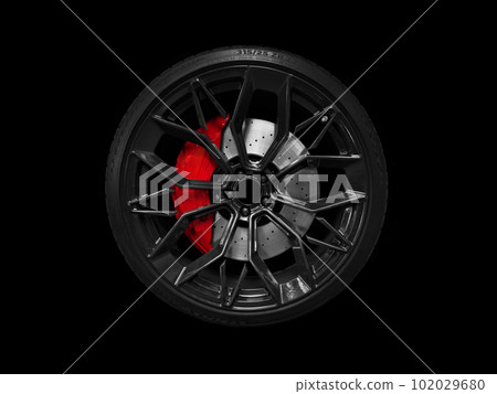 Car alloy wheel and tyre isolated on black background. New alloy wheel with tire and yellow carbon ceramic brakes. Alloy rim isolated. Car wheel disc. Car spare parts.. 102029680